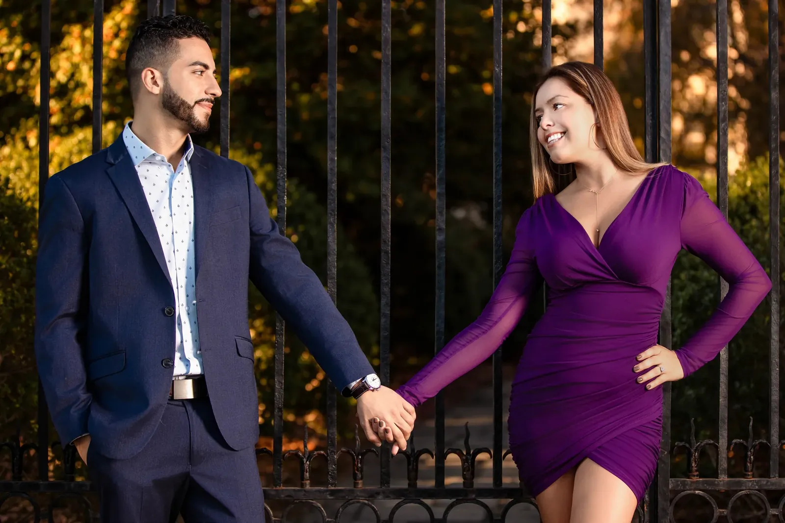 Couple holding hands at golden hour for a dramatic engagement portrait — George Pompilio Photography